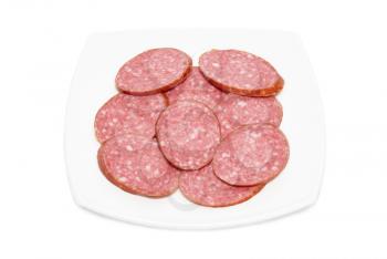 Sliced sausage with plate isolated on white