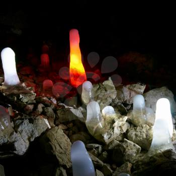 Multicolored ice stalagmites in the cave.
