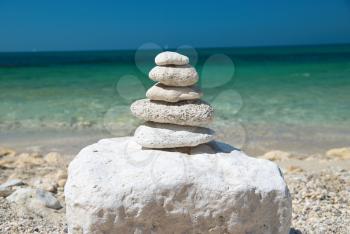 Stone tower with blue sky and sea background