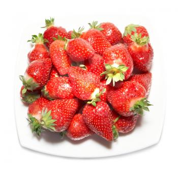 Red strawberries on the white plate