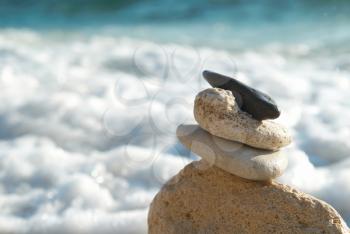 Zen stones with blue sky and sea background