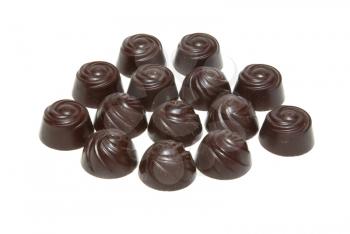 Delicious dark chocolate pralines isolated on white.