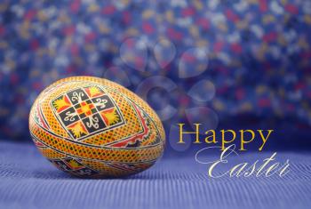 Easter egg painted in beautiful ethnic pattern. Old, traditional handcraft design. Isolated. Close up.