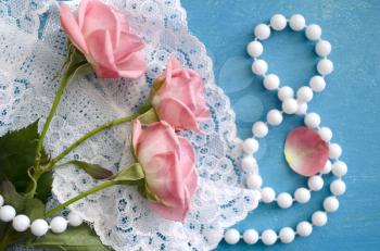 Bouquet of roses and pearl necklace in a figure 8. Women's Day greeting card. 8 March. International Happy Women's Day. The 8th of March banner and poster.