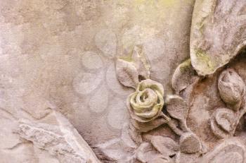 Medieval stone texture with a handmade rose. A fragment of Italian architecture. Creative background.