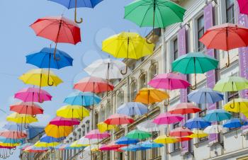 Lviv city colorful umbrellas on the street.Romantic scenery on the background of ancient architecture