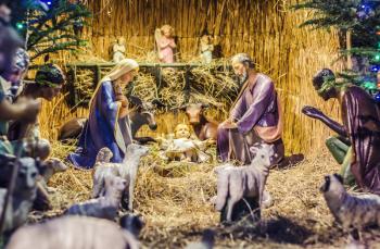 Wooden statue of Christmas, figures of the Virgin Mary and Jesus in the manger.Christmas composition.