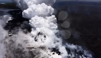 Clubs of smoke from the volcano. White smoke of the volcano, water vapor
