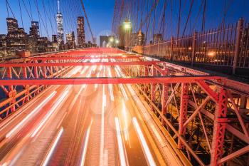 Night lights of car headlamps on the Brooklyn bridge. Long exposure.