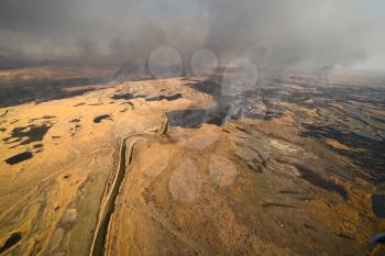 tundra fire. Burning dry grass and peat bogs, fire and smoke in the tundra.