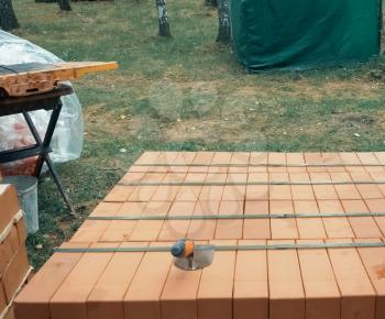 a Construction of red brick, brick masonry.