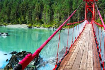 Bridge over turquoise river, Katun river, Altai Mountains, Russia