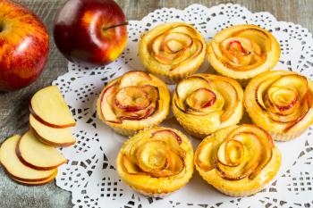 Puff apple shaped roses muffins. Sweet apple dessert pie. Homemade apple rose pastry. 