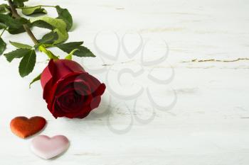Valentines Day background, wedding day background, rose, red and pink ribbon, silk hearts on white wooden background