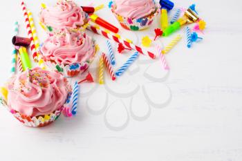 Birthday background with pink cupcakes. Birthday cupcakes. Homemade cupcake. Gourmet cupcakes. Sweet dessert. Sweet pastry. Birthday invitation. Birthday mockup. Styled desktop. Birthday background.