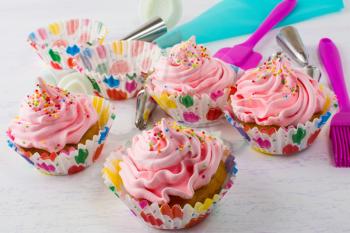 Pink cupcakes  and cookware. Birthday cupcakes. Homemade cupcake. Sweet dessert. Sweet pastry.  Gourmet cupcakes. Sweet cupcake. 