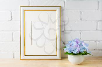 White frame mockup with blue  hydrangea. Empty white frame mockup for design presentation. Portrait or poster white frame mockup for artwork promotion.