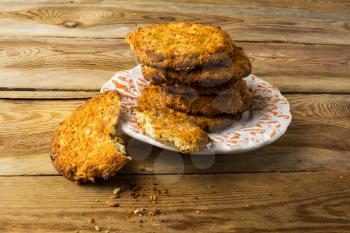 Homemade oatmeal cookies on a rustic wooden table