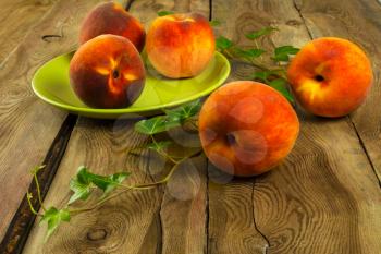 Fruit peaches on a wooden table. Selective focus