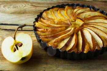 Rustic apple pie, fruit dessert, tart on a wooden table, close up, selective focus