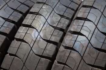 Stack of car tires close up wheel profile structure background