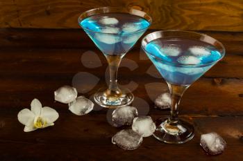 Blue cocktail in a martini glasses. Blue cocktail. Blue Martini. Blue Hawaiian cocktail. Blue curacao liqueur.  Blue margarita