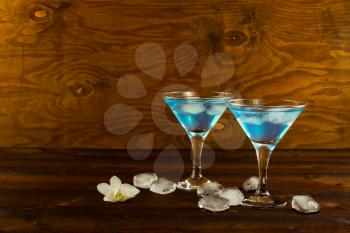 Blue curacao liqueur cocktail in a martini glasses. Blue cocktail. Blue margarita. Blue Hawaiian cocktail. Blue curacao liqueur.  Blue Martini