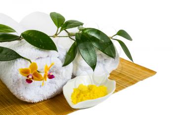 Spa concept with yellow cosmetic salt isolated on white. Wellness concept. Spa still life concept