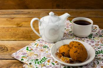 Teapot  and cup of tea, copy space. Homemade biscuit. Homemade cookies.Sweet dessert. Breakfast cookies. Sweet pastry. Cup of tea. Tea cup. Breakfast tea. 