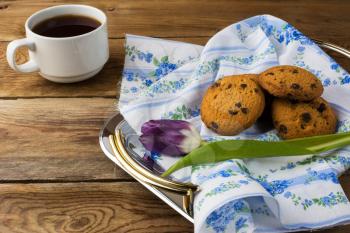Tea cup and cookies on serving tray. Cup of tea. Breakfast tea.  Tea cup. Homemade biscuit. Homemade cookies