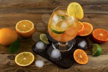 Fresh citrus drink on wooden background.  Fruit cocktail. Fruit drink. Fruit lemonade. Summer drink Citrus lemonade