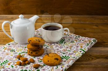 Teapot and Cup of tea. Sweet dessert. Homemade biscuit. Breakfast cookies. Sweet pastry