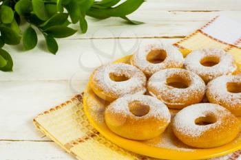 Hanukkah donuts on yellow plate. Sweet dessert. Sweet pastry. Doughnuts.  Donuts. Hanukkah donuts