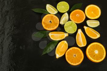 Healthy eating concept with lime, orange and lemon. Fresh vegetarian food. Fresh mixed fruit. Fruit background. Healthy eating concept. 