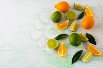Lime and Lemon on light green background. Fruit background. Mixed fruit. Fresh fruit. Fresh food. Ripe fruit. Citrus fruit. Vegetarian food