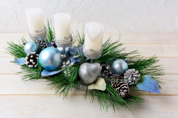 Christmas background with blue ornaments decorated candleholder. Christmas holidays decoration with blue ornaments. Christmas greeting background. 
