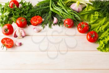 Fresh vegetables on the white wooden background. Healthy eating background. Detox or vegetarian food concept with fresh vegetables.