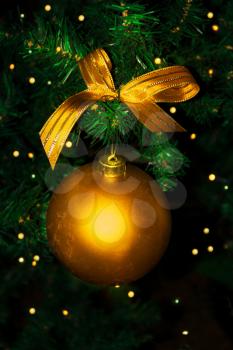 Golden Christmas ornament hanging. Christmas tree and Christmas decoration.