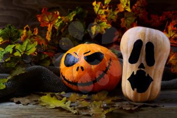 Halloween Stingy Jack pumpkins on dark rustic background. Halloween symbol jack-o-lantern background. Halloween decoration.