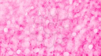 Pink glittering background. Pink bokeh abstract texture.