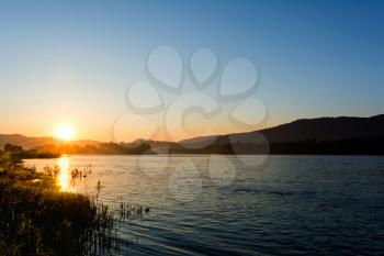 Summer sunrise over beautiful river landscape. Lake landscape. Beautiful landscape with golden sunset.