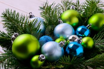 Christmas background with blue and green ornaments. Christmas party decoration with shiny balls.