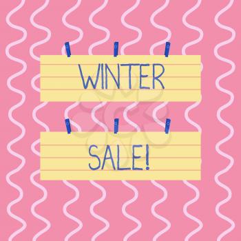 Text sign showing Winter Sale. Business photo showcasing occasion when shop sells things at less than their normal price Two Color Blank Strip Size Lined Paper Sheet Hanging Using Blue Clothespin