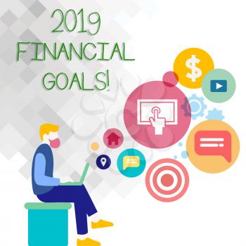Text sign showing 2019 Financial Goals. Business photo showcasing New business strategy earn more profits less investment Man Sitting Down with Laptop on his Lap and SEO Driver Icons on Blank Space