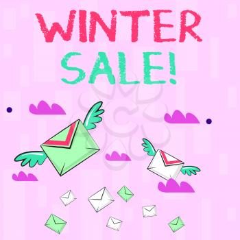 Writing note showing Winter Sale. Business concept for occasion when shop sells things at less than their normal price Colorful Airmail Letter Envelopes and Two of Them with Wings