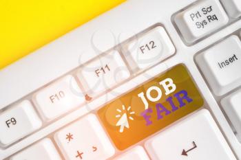 Writing note showing Job Fair. Business concept for An event where a demonstrating can apply for a job in multiple companies White pc keyboard with note paper above the white background