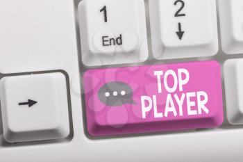 Writing note showing Top Player. Business concept for being best in sports game like football or electronic ones White pc keyboard with note paper above the white background