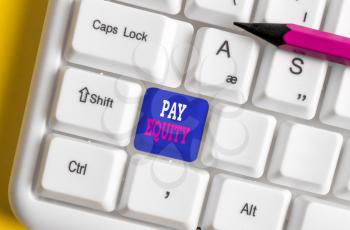 Text sign showing Pay Equity. Business photo text eliminating sex and race discrimination in wage systems White pc keyboard with empty note paper above white background key copy space