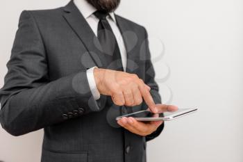 Male human wear formal clothes present presentation use hi tech smartphone