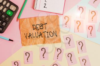 Word writing text Debt Valuation. Business photo showcasing process of determining the current worth of an asset Mathematics stuff and writing equipment above pastel colours background